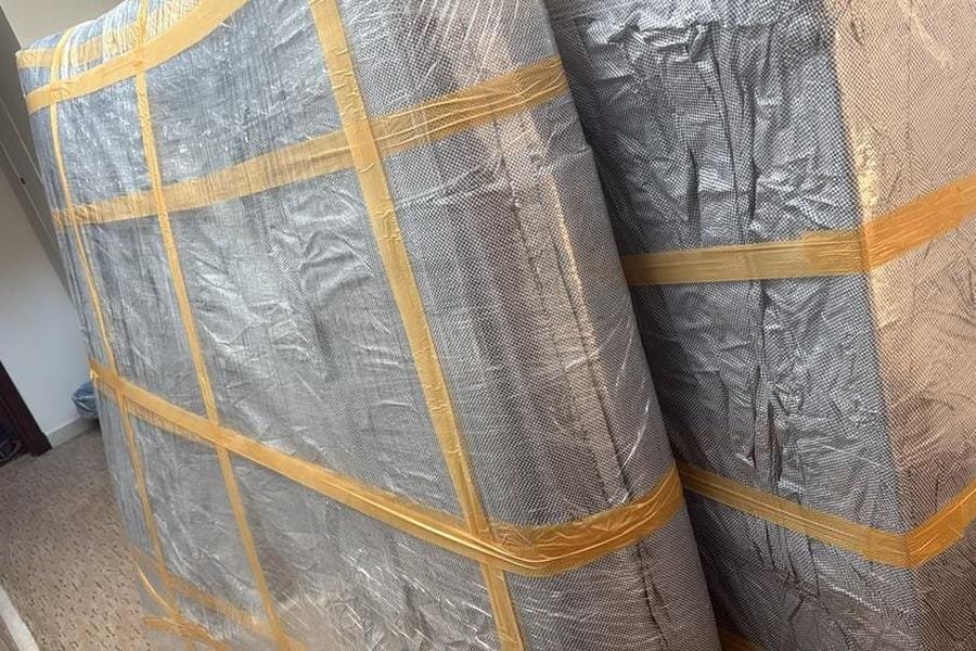 Large furniture items securely wrapped with protective materials